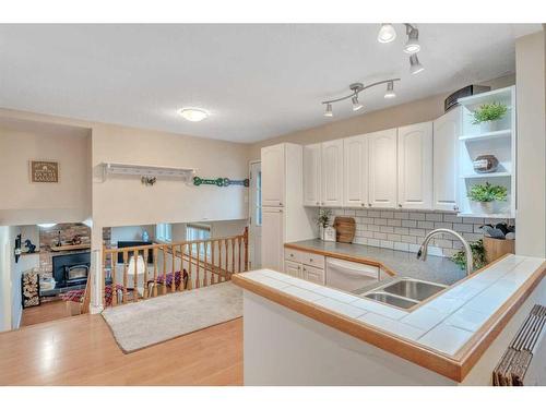 17 Alcock Street, Okotoks, AB - Indoor Photo Showing Kitchen With Double Sink