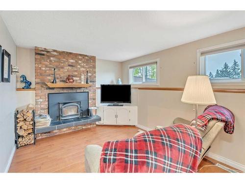 17 Alcock Street, Okotoks, AB - Indoor Photo Showing Living Room With Fireplace