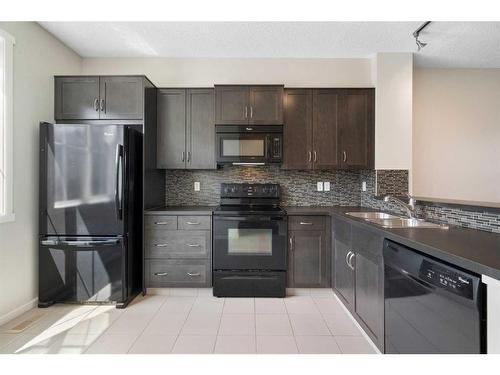 42 Kinlea Common Nw, Calgary, AB - Indoor Photo Showing Kitchen With Double Sink