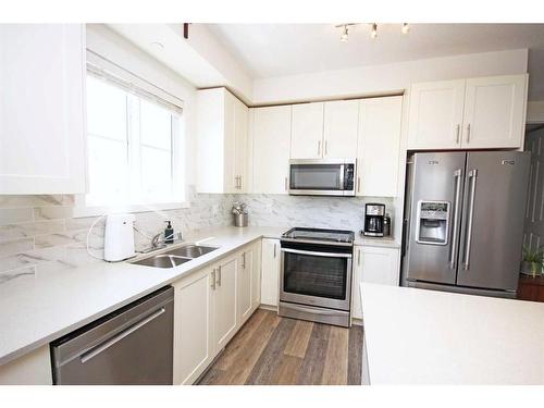 1415-298 Sage Meadows Park Nw, Calgary, AB - Indoor Photo Showing Kitchen With Double Sink With Upgraded Kitchen