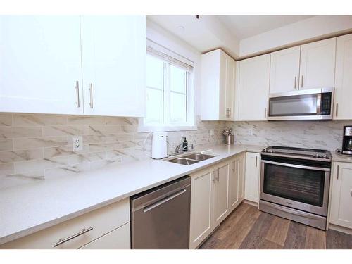 1415-298 Sage Meadows Park Nw, Calgary, AB - Indoor Photo Showing Kitchen With Double Sink