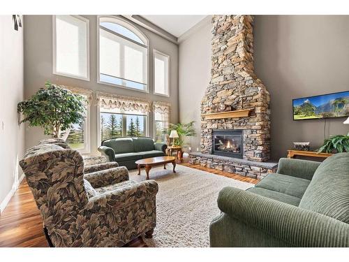 33550 Range Road 23, Rural Mountain View County, AB - Indoor Photo Showing Living Room With Fireplace