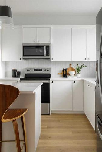 221 Heirloom Way Se, Calgary, AB - Indoor Photo Showing Kitchen With Stainless Steel Kitchen