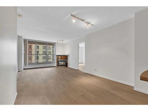 902-650 10 Street Sw, Calgary, AB - Indoor Photo Showing Other Room With Fireplace