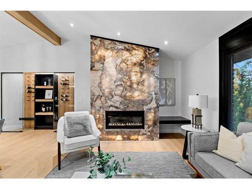 3604 Chippendale Drive Nw, Calgary, AB - Indoor Photo Showing Living Room With Fireplace