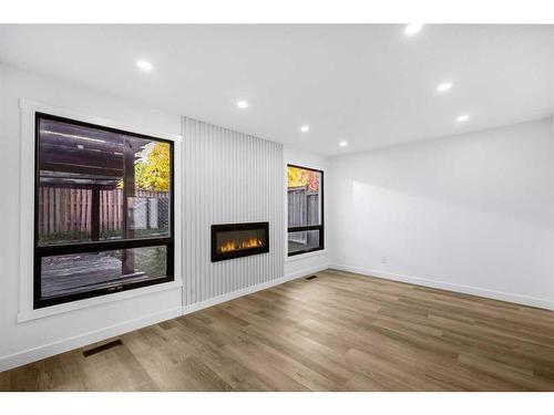 68 Hawkville Place Nw, Calgary, AB - Indoor With Fireplace