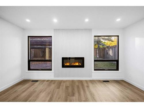 68 Hawkville Place Nw, Calgary, AB - Indoor With Fireplace