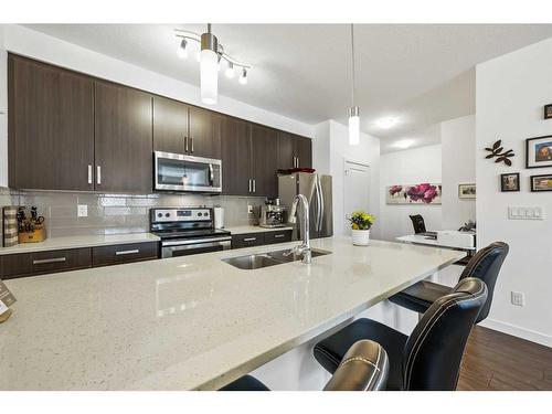 109-200 Cranfield Common Se, Calgary, AB - Indoor Photo Showing Kitchen With Double Sink With Upgraded Kitchen