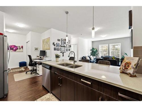 109-200 Cranfield Common Se, Calgary, AB - Indoor Photo Showing Kitchen With Double Sink