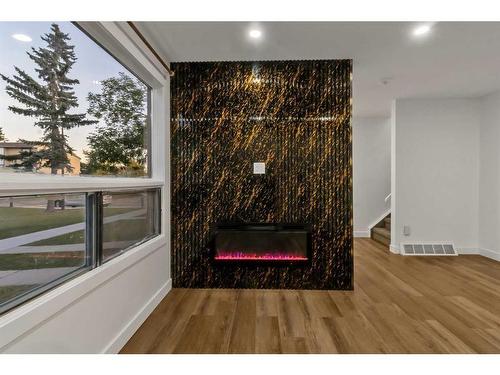 112-2720 Rundleson Road Ne, Calgary, AB - Indoor Photo Showing Other Room With Fireplace