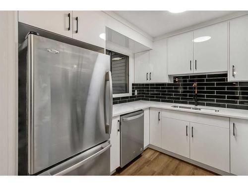 112-2720 Rundleson Road Ne, Calgary, AB - Indoor Photo Showing Kitchen With Double Sink