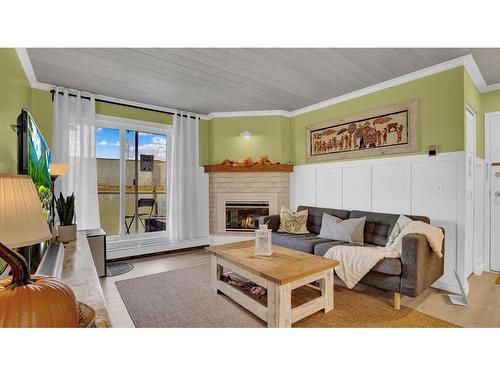 14-2714-3400 Edenwold Heights, Calgary, AB - Indoor Photo Showing Living Room With Fireplace