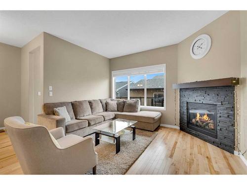 187 Evansridge Circle Nw, Calgary, AB - Indoor Photo Showing Living Room With Fireplace