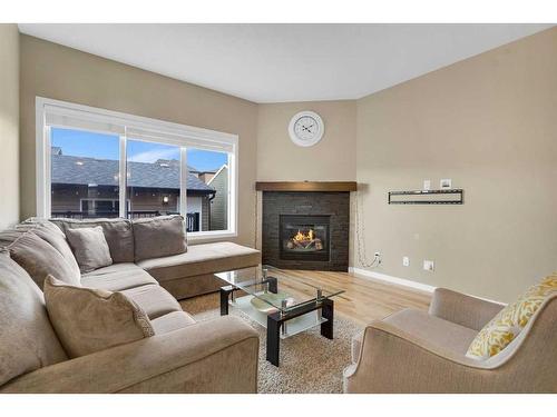 187 Evansridge Circle Nw, Calgary, AB - Indoor Photo Showing Living Room With Fireplace