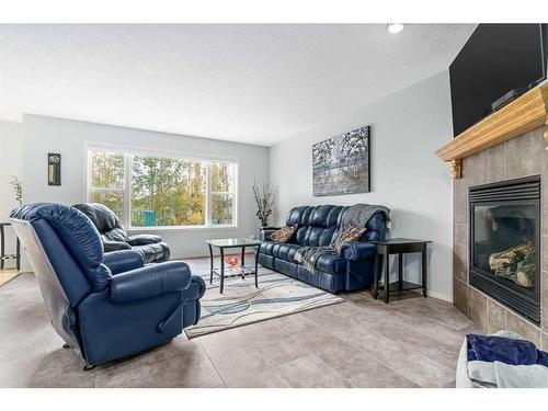 292 Evansbrooke Way Nw, Calgary, AB - Indoor Photo Showing Living Room With Fireplace