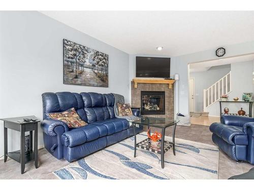 292 Evansbrooke Way Nw, Calgary, AB - Indoor Photo Showing Living Room With Fireplace