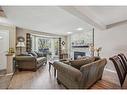 247 Edgebrook Circle Nw, Calgary, AB  - Indoor Photo Showing Living Room With Fireplace 