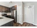 106-605 17 Avenue Nw, Calgary, AB  - Indoor Photo Showing Kitchen With Stainless Steel Kitchen With Double Sink 