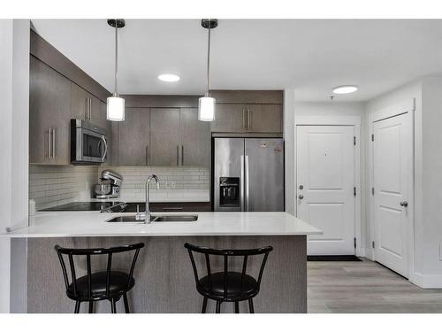 2113-302 Skyview Ranch Drive Ne, Calgary, AB - Indoor Photo Showing Kitchen With Stainless Steel Kitchen With Double Sink With Upgraded Kitchen