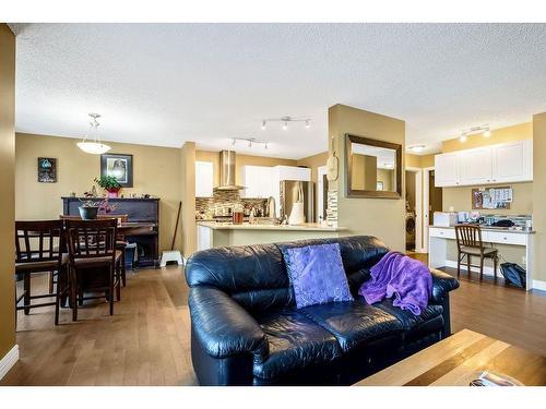 145 Crystal Shores Grove, Okotoks, AB - Indoor Photo Showing Living Room