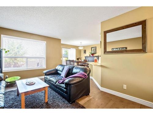 145 Crystal Shores Grove, Okotoks, AB - Indoor Photo Showing Living Room