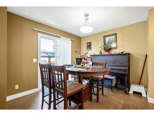 145 Crystal Shores Grove, Okotoks, AB - Indoor Photo Showing Dining Room