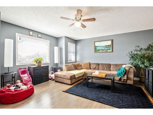 145 Crystal Shores Grove, Okotoks, AB - Indoor Photo Showing Living Room