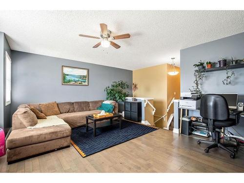 145 Crystal Shores Grove, Okotoks, AB - Indoor Photo Showing Living Room