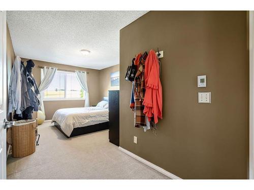 145 Crystal Shores Grove, Okotoks, AB - Indoor Photo Showing Bedroom