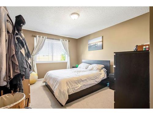 145 Crystal Shores Grove, Okotoks, AB - Indoor Photo Showing Bedroom