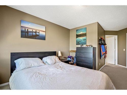 145 Crystal Shores Grove, Okotoks, AB - Indoor Photo Showing Bedroom