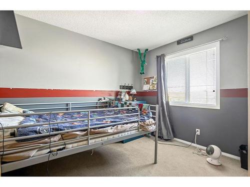 145 Crystal Shores Grove, Okotoks, AB - Indoor Photo Showing Bedroom