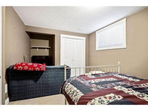 145 Crystal Shores Grove, Okotoks, AB - Indoor Photo Showing Bedroom