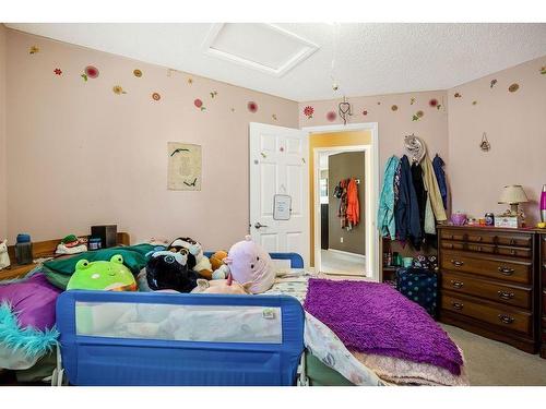 145 Crystal Shores Grove, Okotoks, AB - Indoor Photo Showing Bedroom