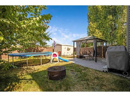 145 Crystal Shores Grove, Okotoks, AB - Outdoor With Backyard