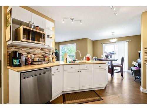 145 Crystal Shores Grove, Okotoks, AB - Indoor Photo Showing Kitchen