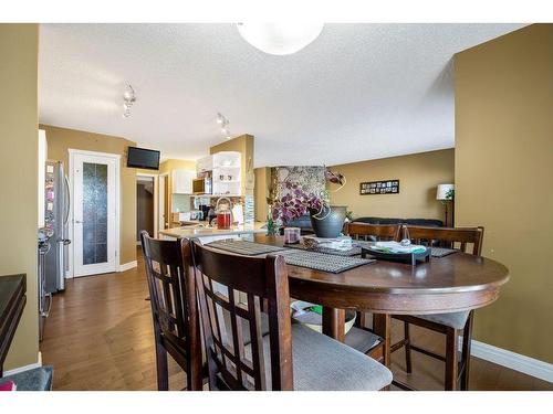 145 Crystal Shores Grove, Okotoks, AB - Indoor Photo Showing Dining Room