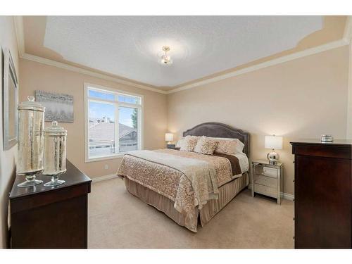 22 Discovery Woods Villas Sw, Calgary, AB - Indoor Photo Showing Bedroom