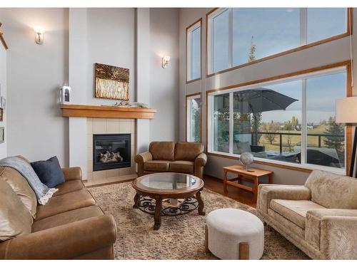 93 Brightonwoods Gardens Se, Calgary, AB - Indoor Photo Showing Living Room With Fireplace