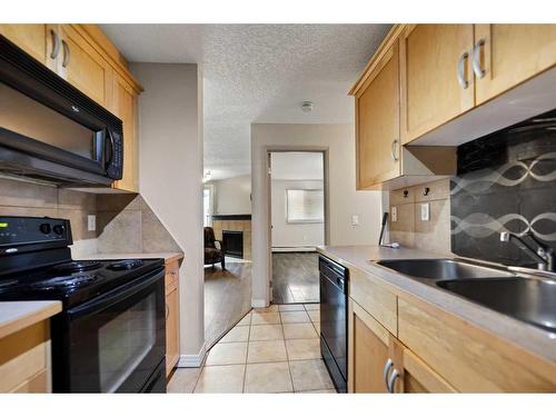 1108-13045 6 Street Sw, Calgary, AB - Indoor Photo Showing Kitchen With Double Sink