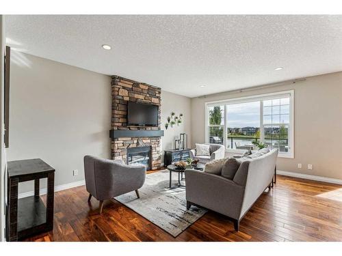 122 Canals Close Sw, Airdrie, AB - Indoor Photo Showing Living Room With Fireplace