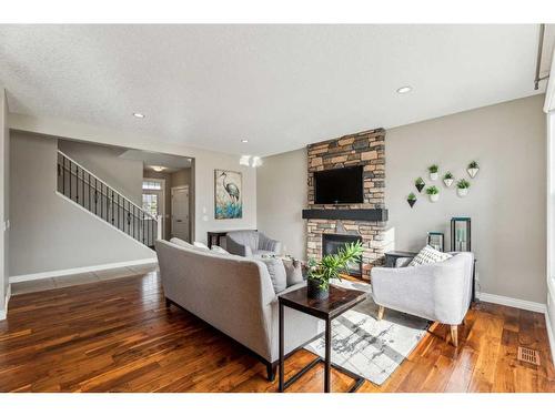 122 Canals Close Sw, Airdrie, AB - Indoor Photo Showing Living Room With Fireplace