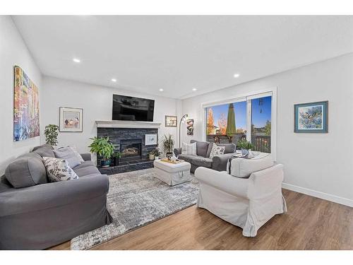 31 Schooner Close Nw, Calgary, AB - Indoor Photo Showing Living Room With Fireplace