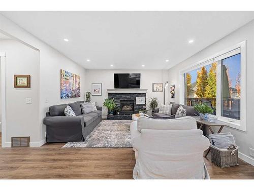 31 Schooner Close Nw, Calgary, AB - Indoor Photo Showing Living Room With Fireplace