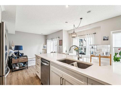 1005-250 Fireside View, Cochrane, AB - Indoor Photo Showing Kitchen With Double Sink