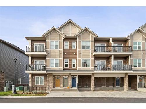 1005-250 Fireside View, Cochrane, AB - Outdoor With Balcony With Facade