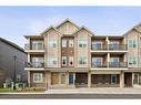 1005-250 Fireside View, Cochrane, AB  - Outdoor With Balcony With Facade 