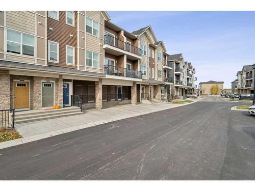 1005-250 Fireside View, Cochrane, AB - Outdoor With Balcony With Facade