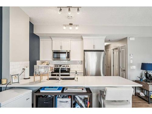 1005-250 Fireside View, Cochrane, AB - Indoor Photo Showing Kitchen With Stainless Steel Kitchen