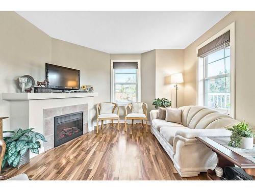 318-50 Westland Road, Okotoks, AB - Indoor Photo Showing Living Room With Fireplace